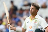 Australia batter David Warner acknowledges the crowd as he leaves the field after being dismissed in the Boxing Day Test.
