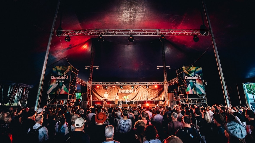 A picture of a stage at Bluesfest a large crowd in front