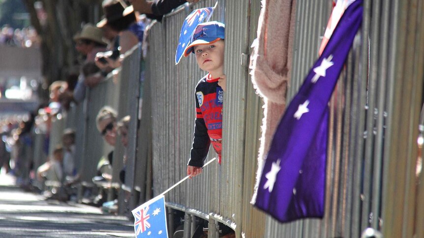 Bayley Waldon, 3, waits for the arrival of the Anzac Day march in Brisbane, April 25, 2015.