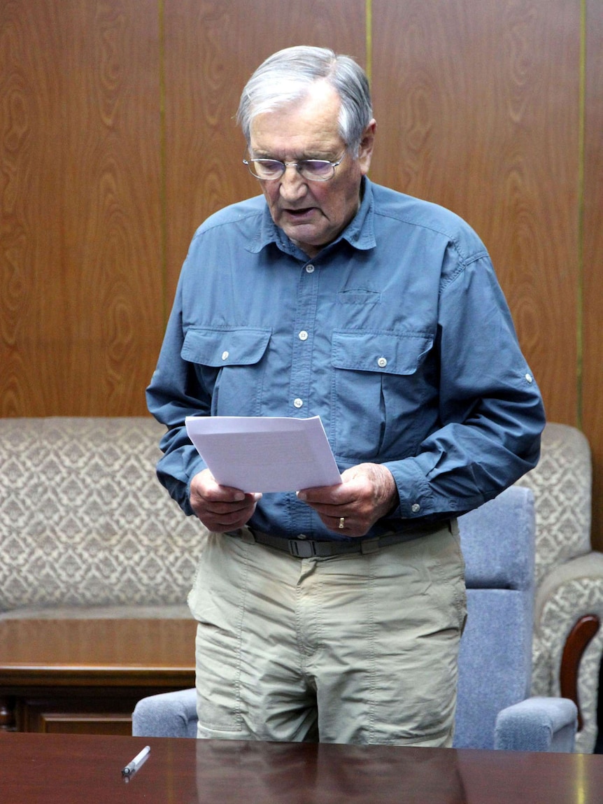 Merrill Newman reads an apology for alleged crimes