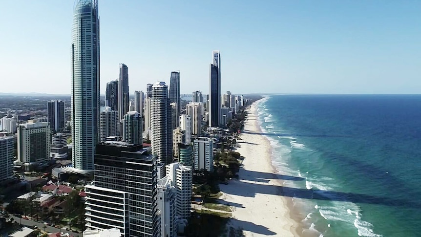 An aerial photo of Surfers Paradise skyline, buildings and beach.