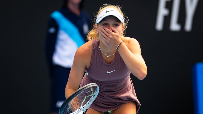 Emerson Jones touches her mouth at the Australian Open.