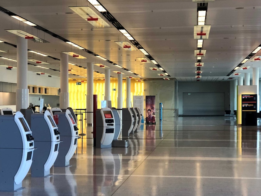 An empty airport passenger counter.