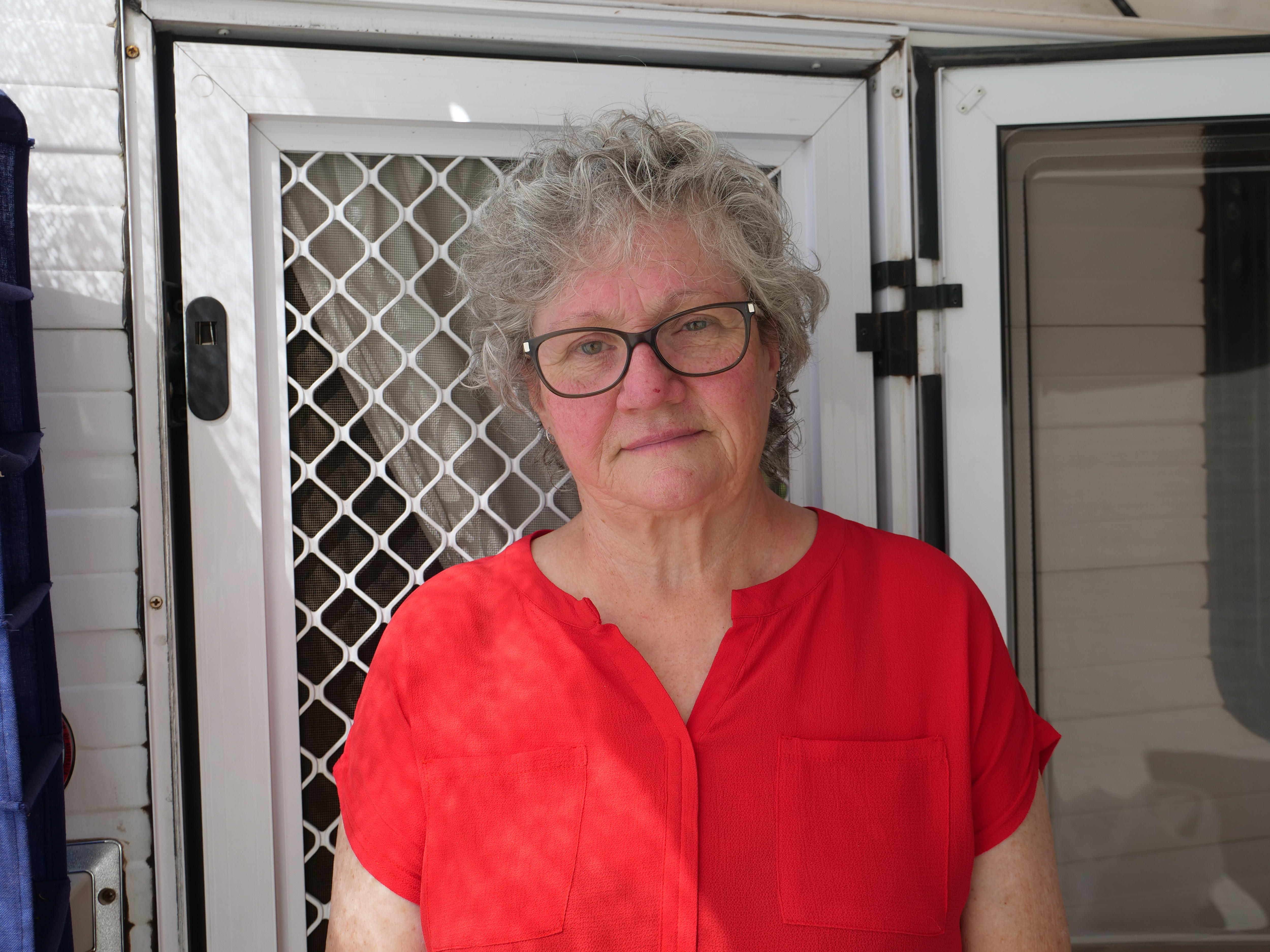 Evelyn Hardy out the front of her caravan. 