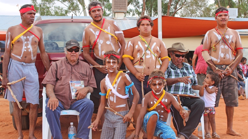 Wajarri dance group and elder with the dictionary