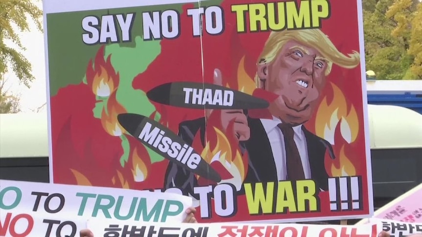 Dozens of anti-Trump protesters gathered in Seoul to protest against Mr Trump's visit to South Korea.
