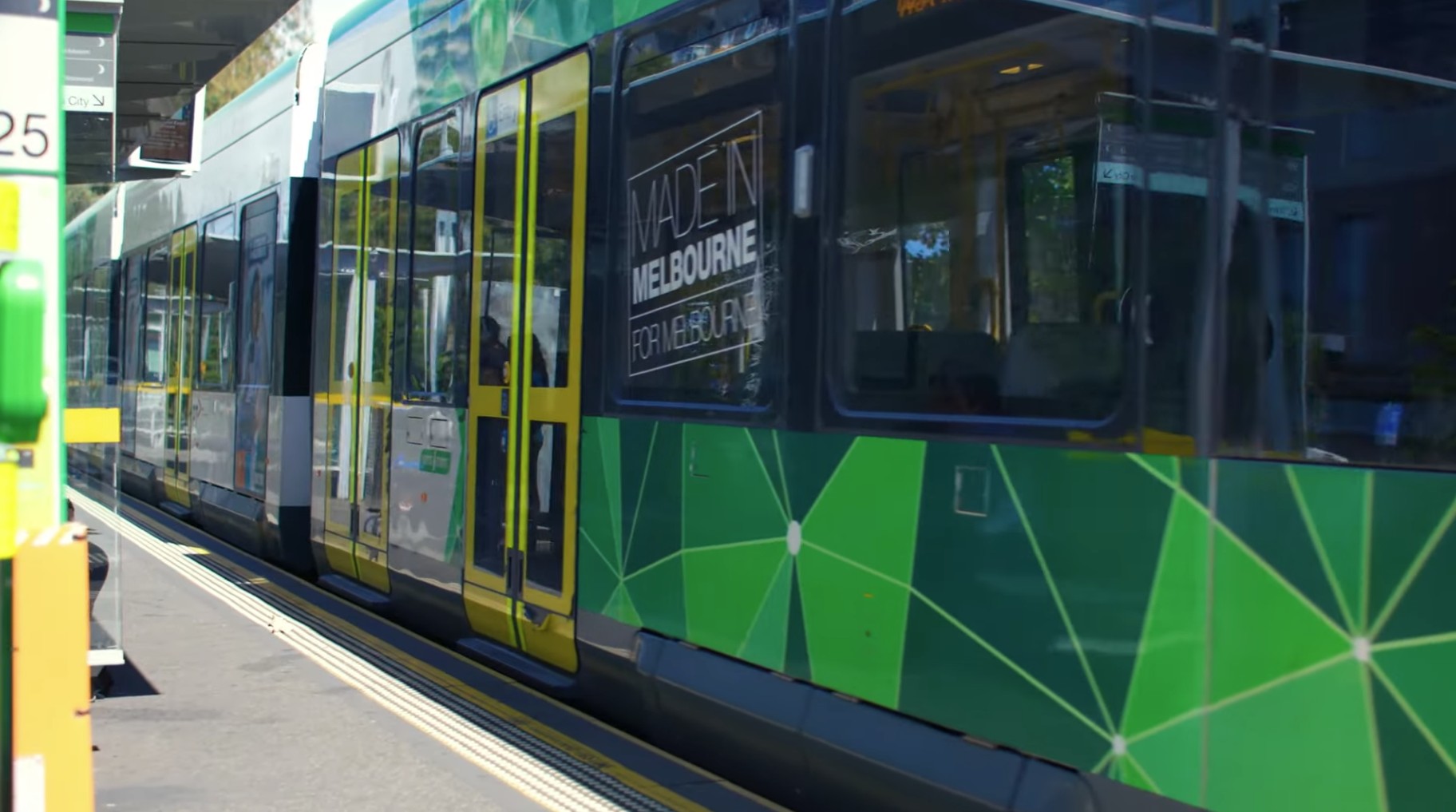 Green Melbourne tram terminates at tram stop.