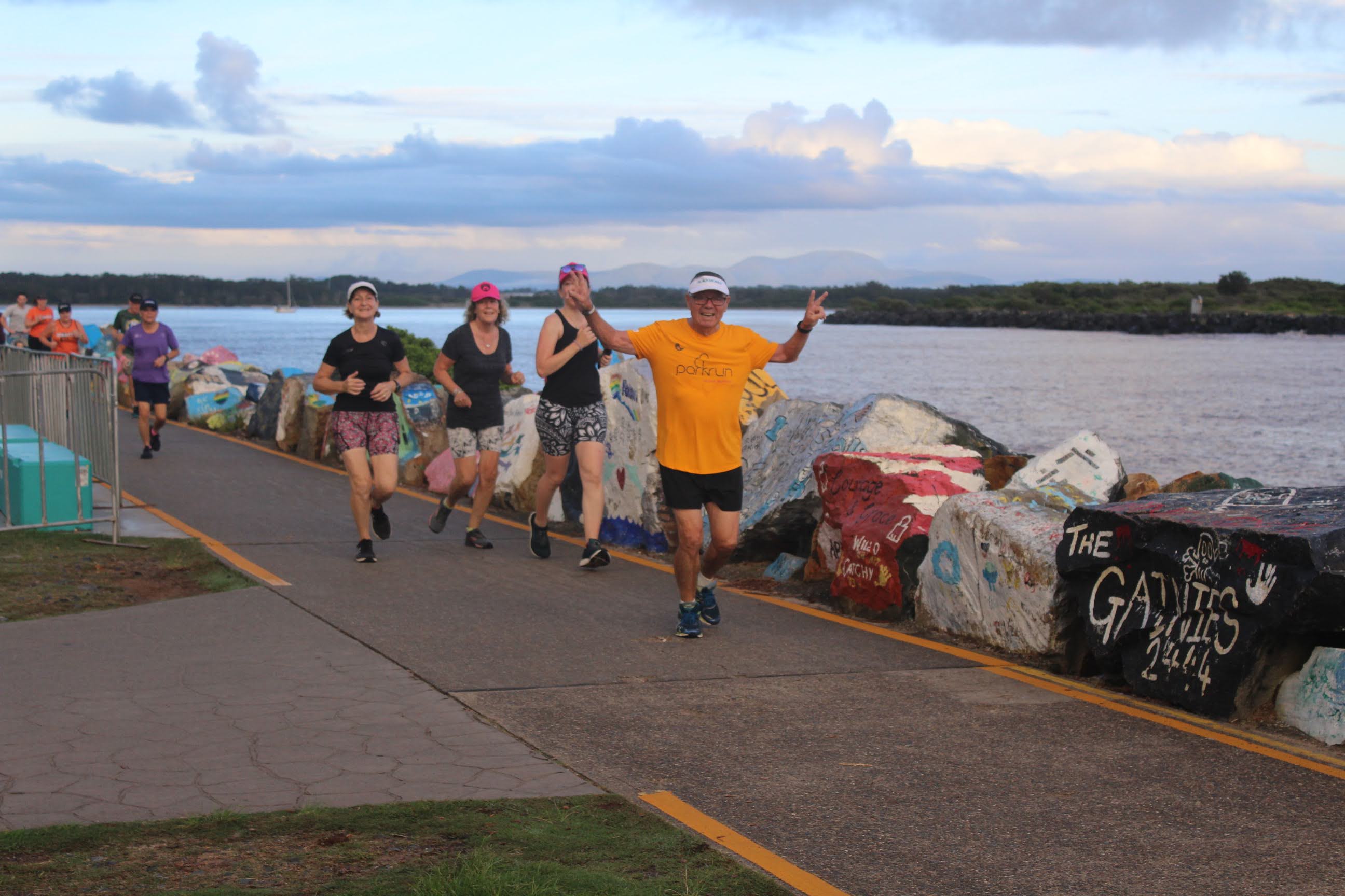Abdon Ulloa runs along the water at Port Macquarie parkrun.