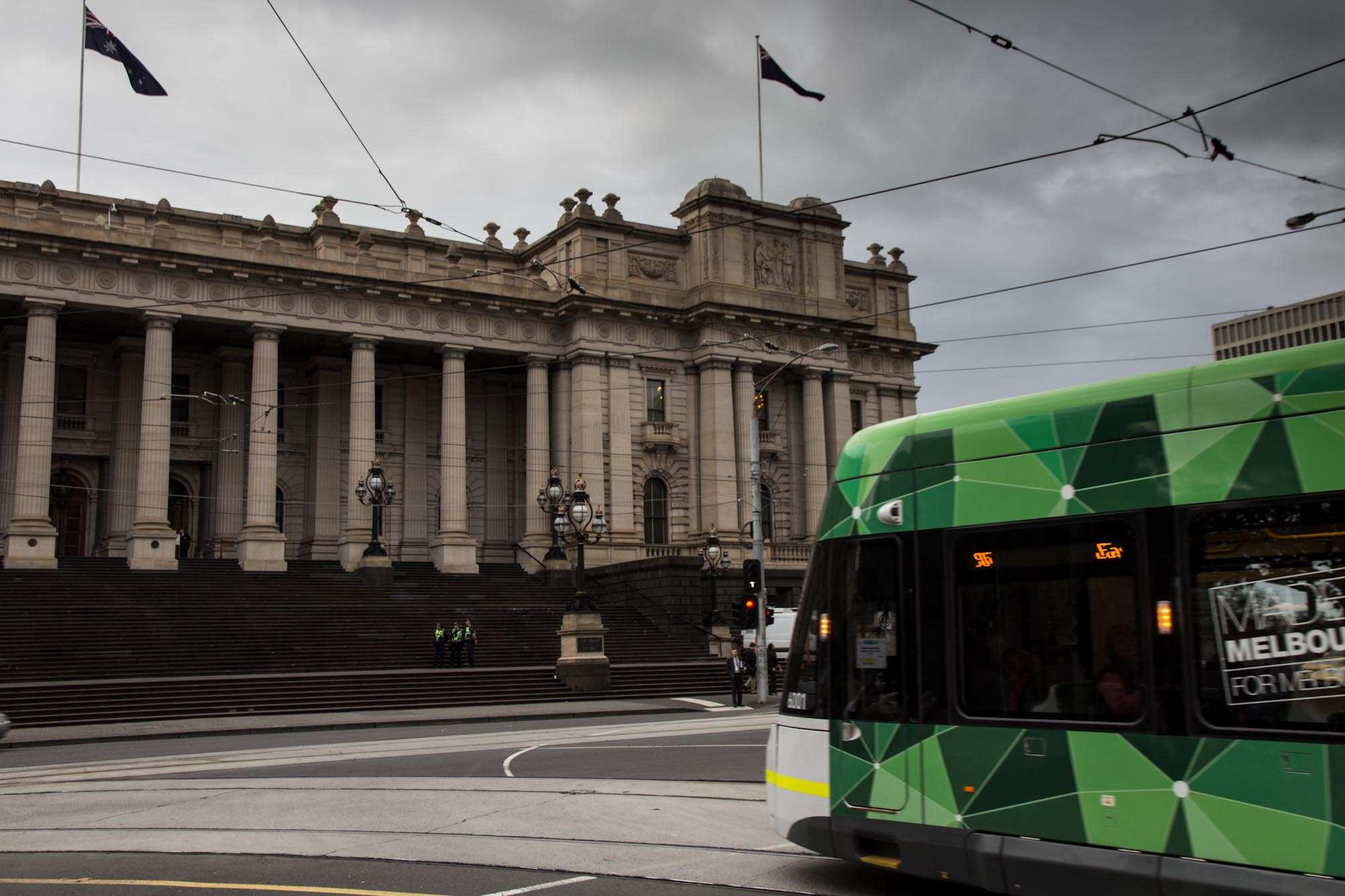 A tram passes the Victorian Parliament
