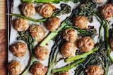 A tray of just baked pork meatballs and broccolini brushed with a sticky soy glaze, a midweek family dinner.
