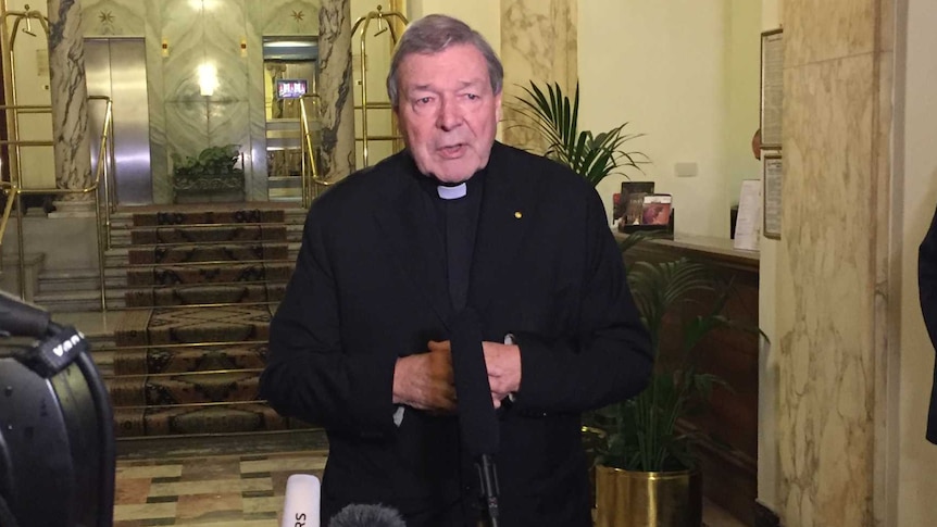 Cardinal George Pell speaking to media outside the Hotel Quirinale