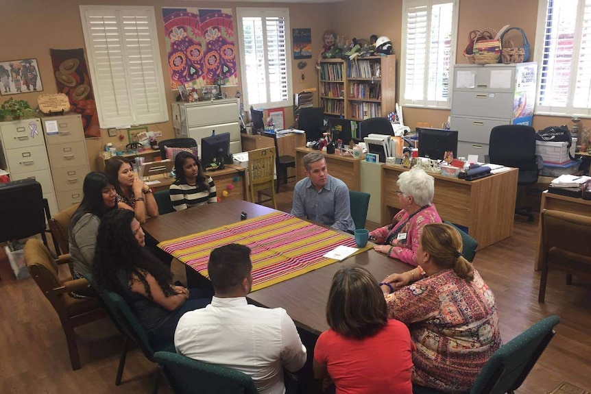 Sister Ann Kendrick speaks with people at the Hope Community Centre in Apopka.