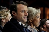 French President elect Emmanuel Macron celebrates on stage with his wife Brigitte Trogneux.