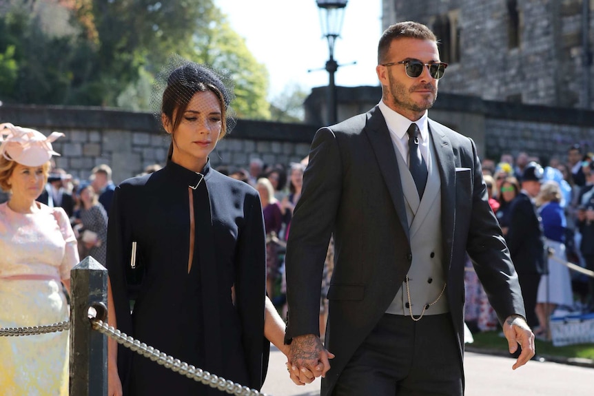 David Beckham and Victoria Beckham arrive for the wedding ceremony.