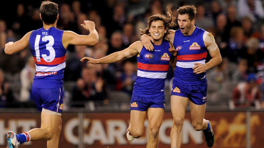 The Western Bulldogs' Luke Dahlhaus is congratulated after his goal against West Coast.