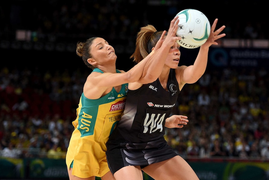 Contested ball ... Grace Rasmussen (R) of the Silver Ferns competes for possession with Kimberley Ravaillion