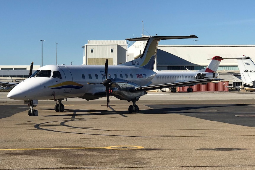 A grounded plane on a the tarmac