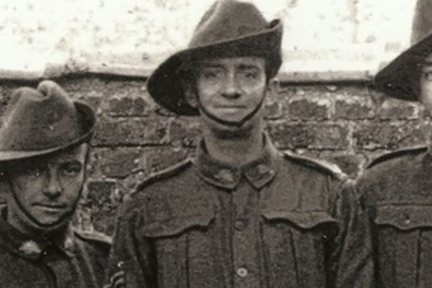 A soldier stands in uniform