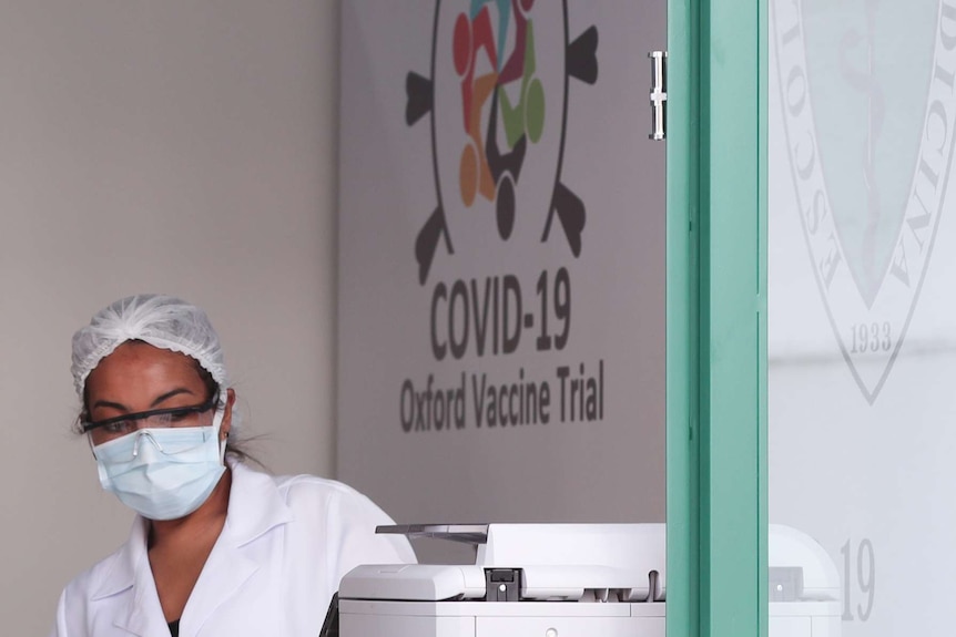 An employee wears a mask, glasses and a hairnet during Brazilian trials for the potential coronavirus vaccine developed by Oxford.