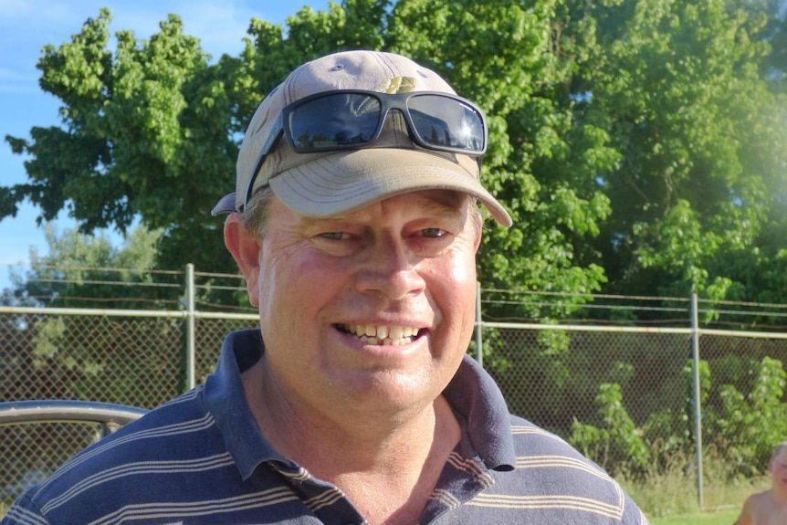 Ian Coggan, president of Jugiong Swimming Club, smiles at the camera.