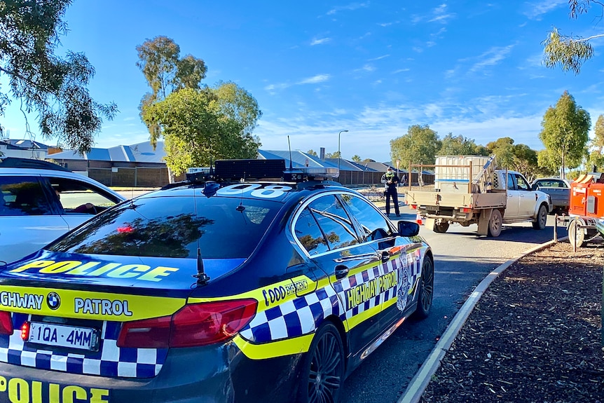 Police Car with lights flashing.