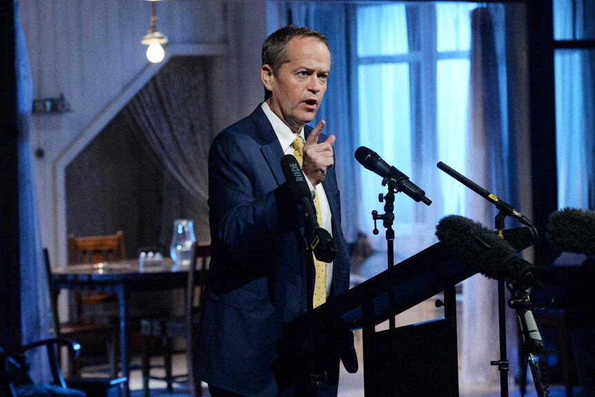 Bill Shorten points his finger as he speaks into a number of microphones at the Malthouse Theatre in Melbourne.