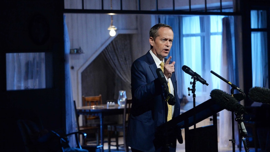 Bill Shorten points his finger as he speaks into a number of microphones at the Malthouse Theatre in Melbourne.