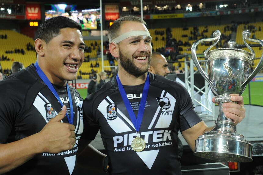 New Zealand's Jason Taumalolo and Jason Nightingale with the Rugby League Four Nations trophy