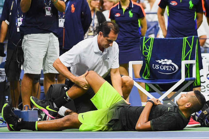 Nick Kyrgios receives attention during his US Open match against Illya Marchenko