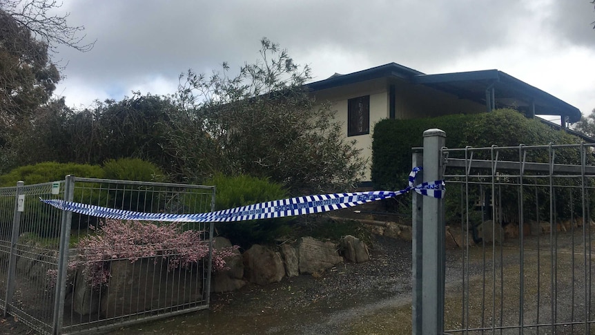 Crime scene tape at a house.