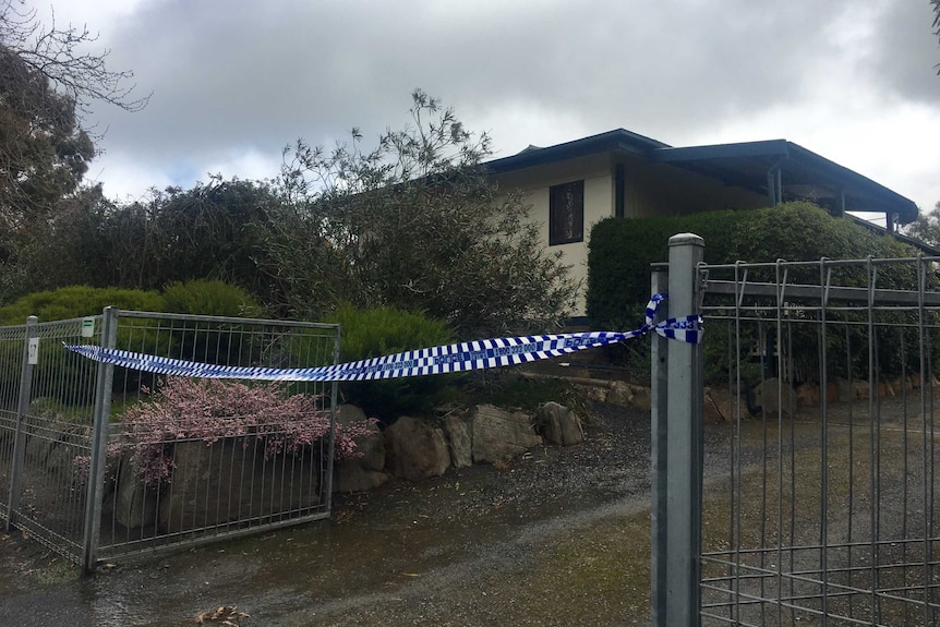 Crime scene tape at a house.