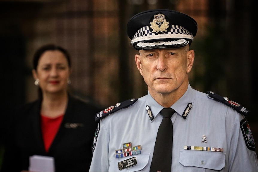 Steve Gollschewski in uniform addresses the media at parliament house in Queensland.