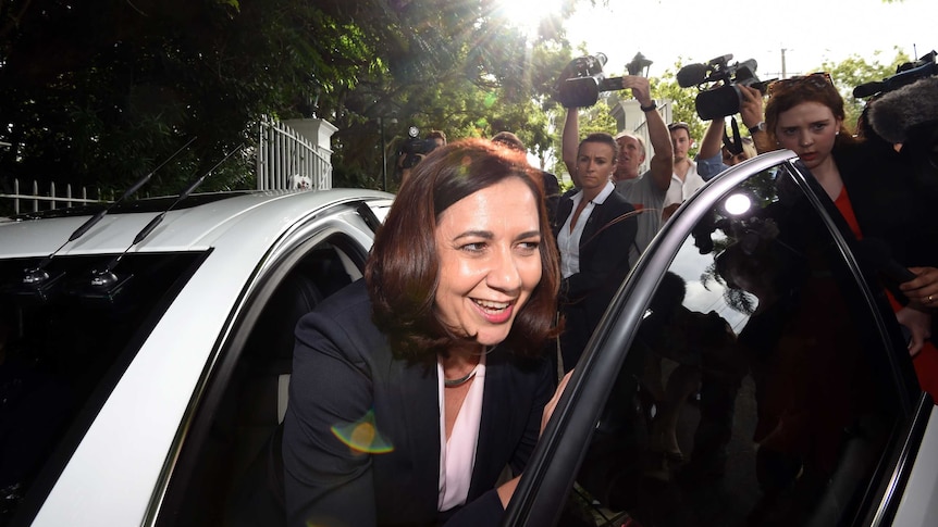 Premier-elect Annastacia Palaszczuk greets waiting media outside Government House in Brisbane.