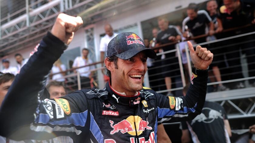 British champion ... Mark Webber celebrates his 2010 Silverstone win.