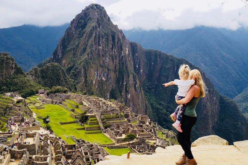 Laura Buttigieg and her daughter Ivy look at the view at Machu Picchu for a story about packing luggage tips.