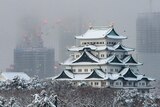 Japan's Nagoya castle covered with snow