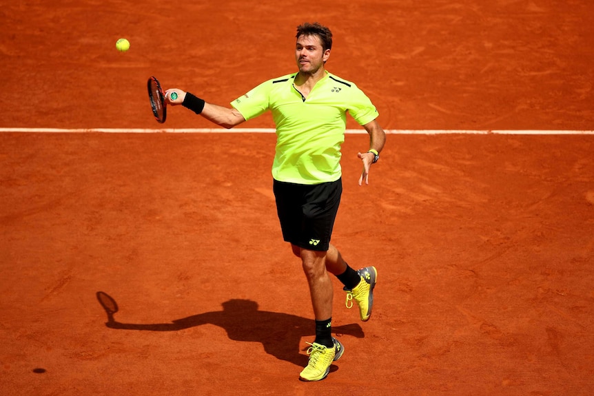 Switzerland's Stan Wawrinka plays a forehand against Taro Daniel at the French Open.