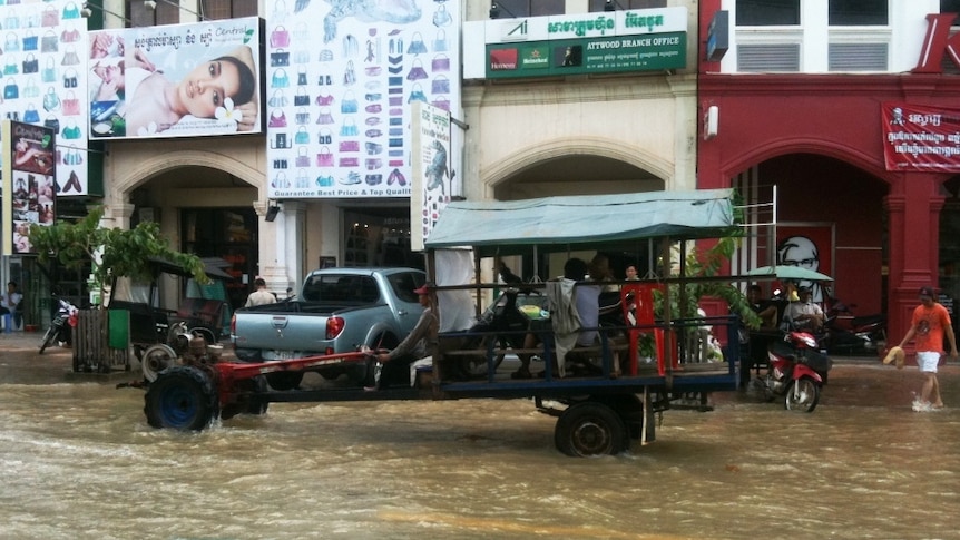 Car drives in Cambodian floods