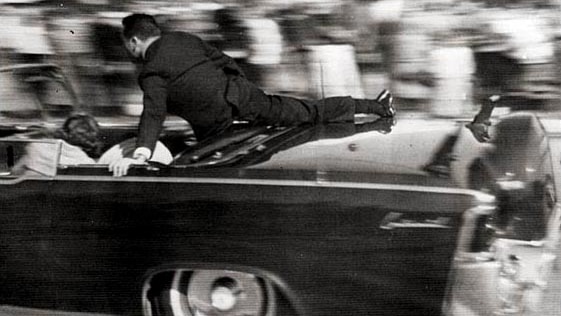 Secret Service agent Clint Hill leaps onto the presidential limousine moments after JFK was shot.