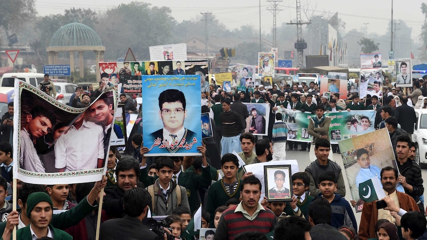 Pakistani relatives of schoolchildren killed in a Taliban attack a school in Peshawar protest