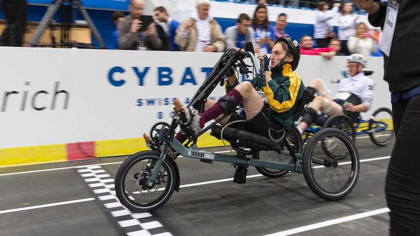 Greg McClure races his FES bike during Cybathlon