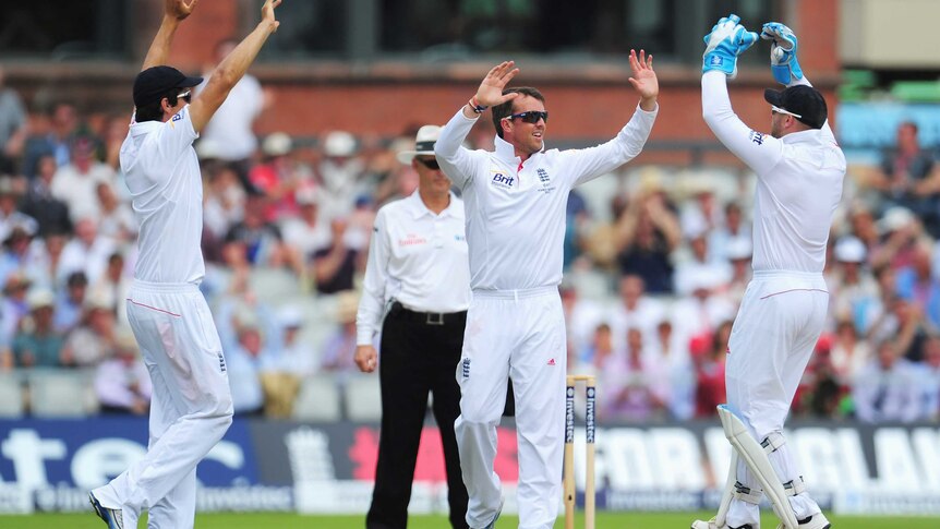 England's Graeme Swann celebrates the wicket of Australia's Usman Khawaja
