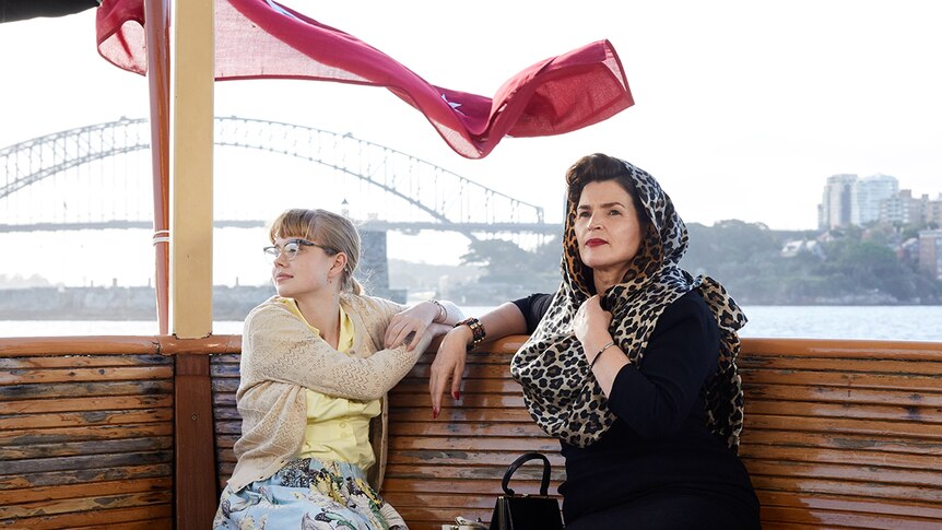 Colour photograph of Angourie Rice and Julia Ormond on a ferry in Sydney Harbour in 2018 film Ladies in Black.