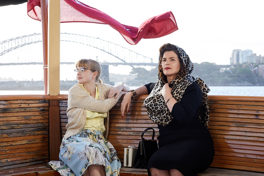 Colour photograph of Angourie Rice and Julia Ormond on a ferry in Sydney Harbour in 2018 film Ladies in Black.