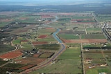 An aerial picture of farmland and an irrigation channel in the Murrumbidgee Irrigation Area in Leeton in south-western NSW