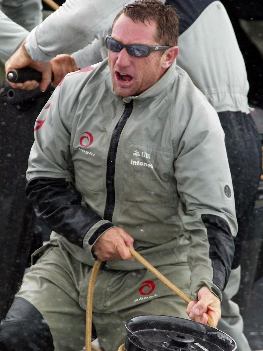 Simon Daubney trims a sail.