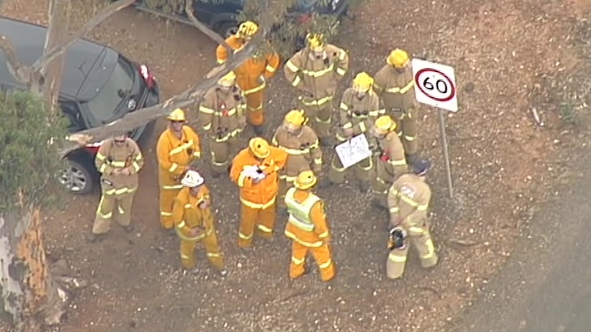 Victorian emergency workers hold a meeting near the scene of two explosions in Bacchus Marsh.