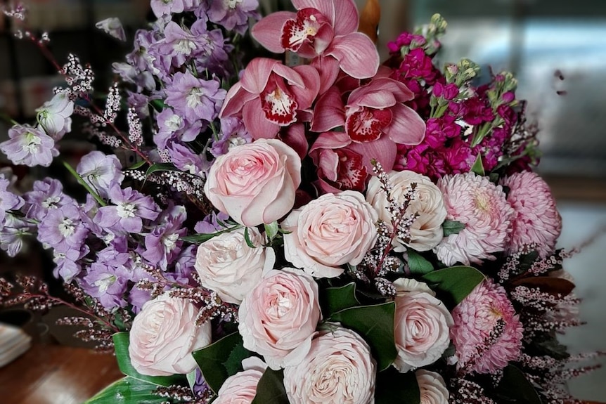 A bunch of colourful flowers in a vase.