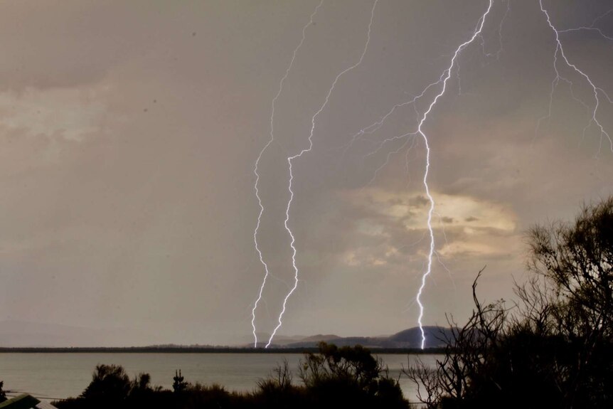 Multiple bolts of lightning strike over Tasmania's Southern Beaches.