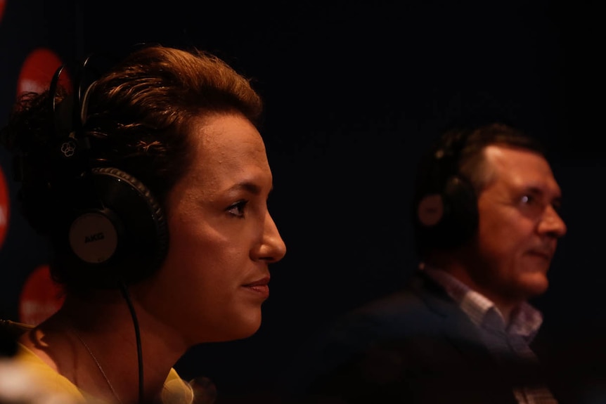 A close-up photo of CLP leader Lia Finocchiaro with Michael Gunner in the background inside the ABC Darwin radio studio.